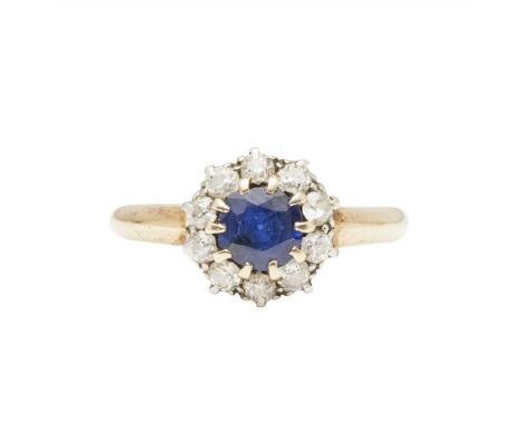 A sapphire and diamond set cluster ring claw set with a round-cut sapphire, in a border of old round-cut diamonds, to a plain