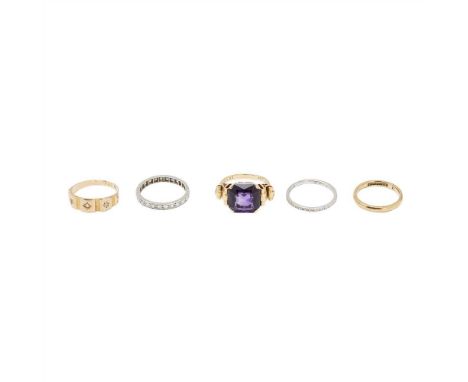 A collection of rings to include a large amethyst set cocktail ring, stamped 18ct; an eight-cut diamond set eternity ring, un