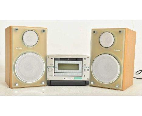 Sony Hi-Fi - Model CMT-PX333 - a micro component system and matching speakers. Silver finish to the unit with a beach wood fi
