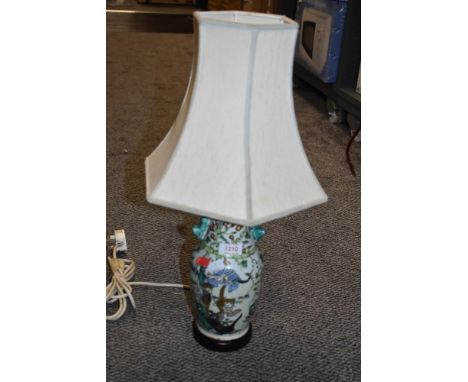 An early 20th century Chinese porcelain lamp base or vase decorated with cats