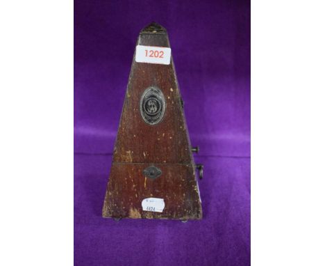 An early 20th century System Maezel Metronome in wooden case.