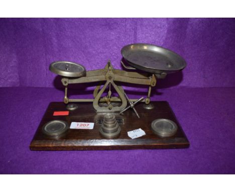 A set of vintage Ensign postal scales with accompanying weight set