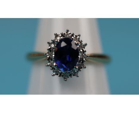 Gold sapphire &amp; diamond cluster ring