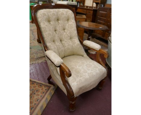 Antique button-back armchair with scroll arms
