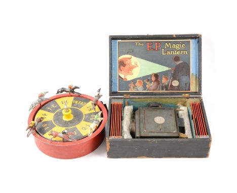 The E.P. Magic Lantern boxed with illustrated box and slides, Welsh Evens lead painted and wood horse racing game, and a Vict