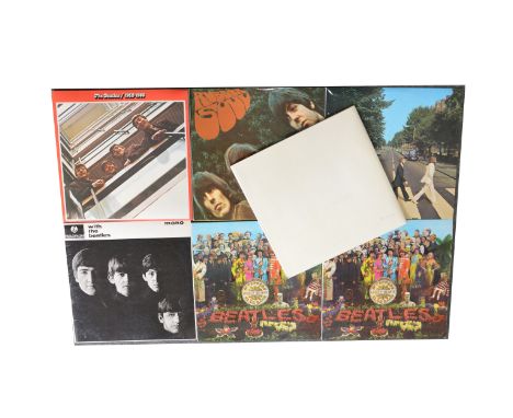 Seven of The Beatles LP vinyl records; including, The White Album no.0281170, with poster and four portrait photos, Sgt Peppe