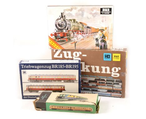 HO gauge railway sets by Piko; BR130 diesel locomotive set with wagons, Old Timer steam locomotive set, Deutschen Reichsbahn 