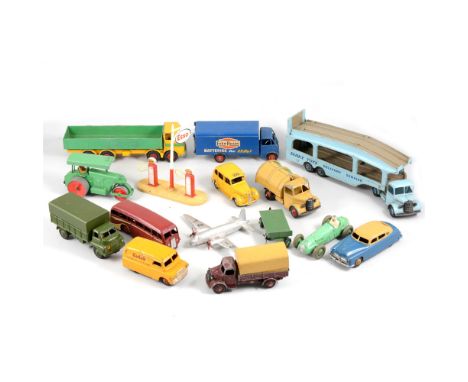 Dinky Toys; a collection of loose playworn examples; including Guy Van 'Ever Ready', Carrimore car transporter, petrol pumps 