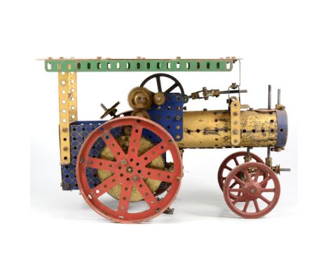 A good quantity of mostly pre-war Meccano; including part built traction engine models, gold and dark blue girders, strips, b
