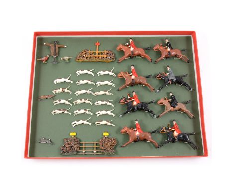 Britains Toys paint lead hunting scene figures, including dogs and fox, the hunt, fencing and shrubs, (possibly repainted).