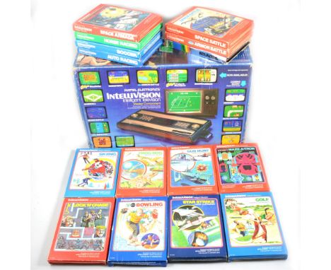 Mattel Electronics Intellivision early games console, in original box, with fifteen boxed games and TV cabel.
