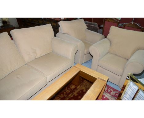 Three piece suite comprising of two seat sofa and a pair of matching armchairs in oatmeal fabric 