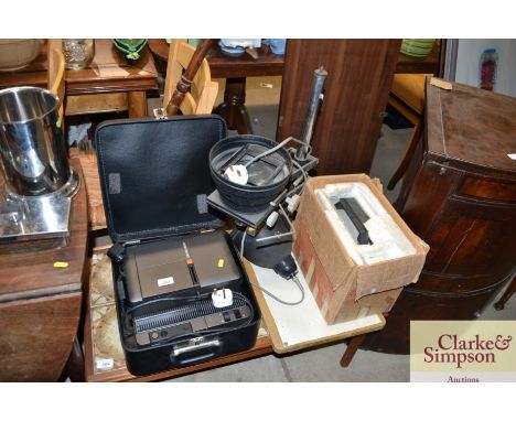 A photography darkroom lamp, Zeiss Ikon slide projector; and a cine projector