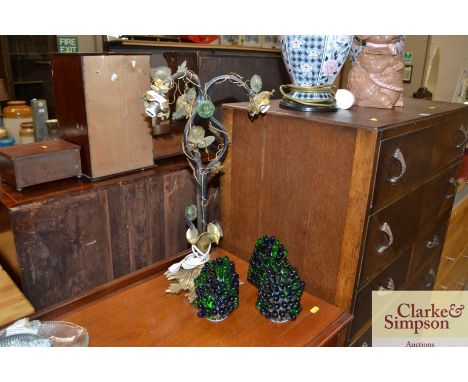 An unusual three branch table lamp, having simulated grape shades 