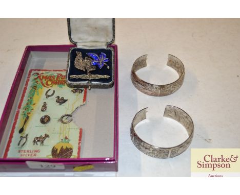 A silver marcasite brooch; an enamel marcasite brooch another; two bangles etc.
