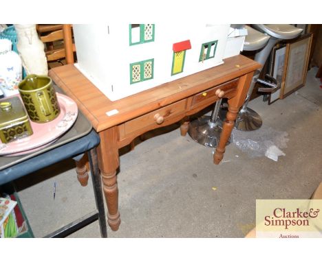 A modern stripped pine two drawer side table 