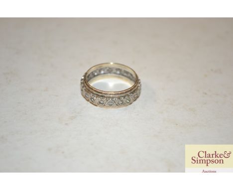 A gold and silver eternity ring (size RS) 4gms in weight 