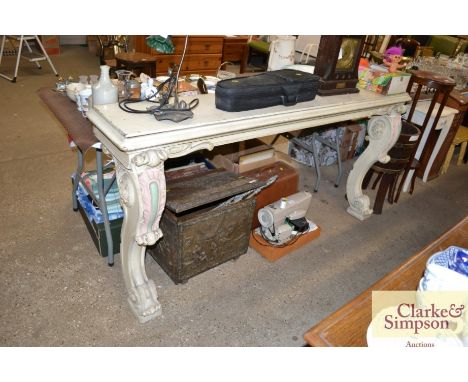 A carved and painted console table