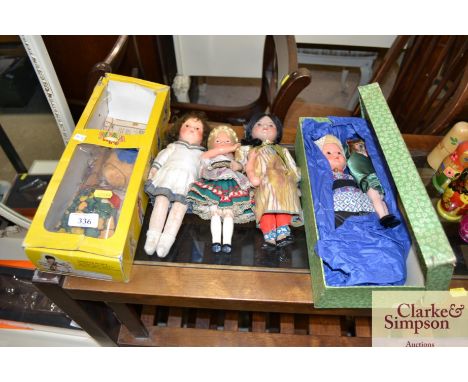 A Pelham puppet; three various dressed dolls and two others in a box 