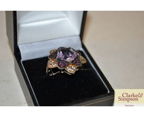 A pentagon shaped amethyst set dress ring 