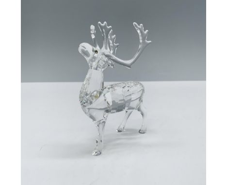 Spectacular crystal clear faceted figure that depicts a reindeer posed in a proud position with their head up towards the sky