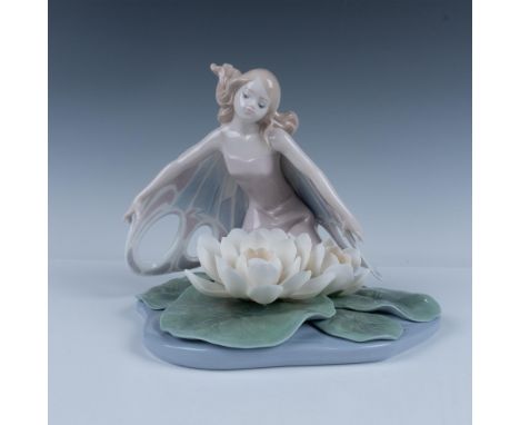 Glossy porcelain figure of a fairy with expanded wings kneeling over delicate water lilies. Lladro backstamp. This item has i