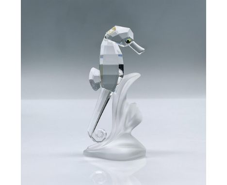 This adorable seahorse is made from clear crystal. It's attached to a piece of frosted crystal. This item has its original bo
