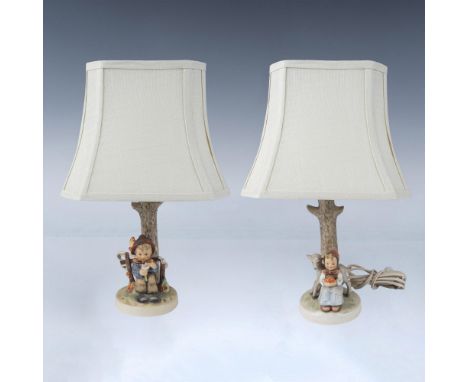 Hand painted pair of porcelain figural lamps in a matte finish of two children. 1 Make a Wish, featuring a little girl with a
