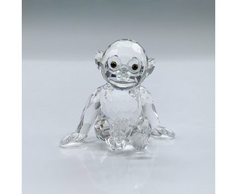 This item was a part of the African Wildlife group. Features a clear crystal chimpanzee with dark eyes. This item has its ori