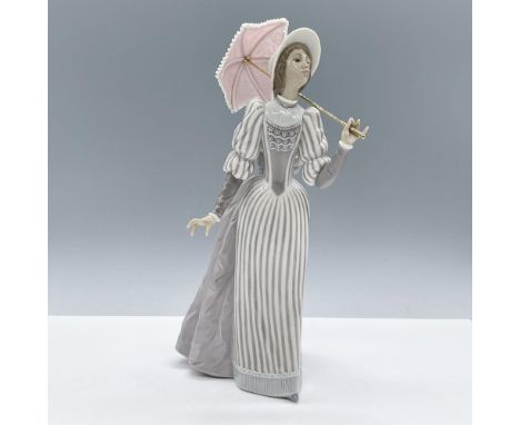 Glossy finish figure modeled as an English lady peering in the distance as she holds a small parasol. Lladro backstamp. Artis
