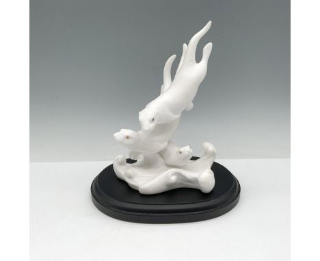 Adorable hand-crafted white bisque of otters playing in the water. Lenox backstamp. This item has a base included: 7"L x 5.5"
