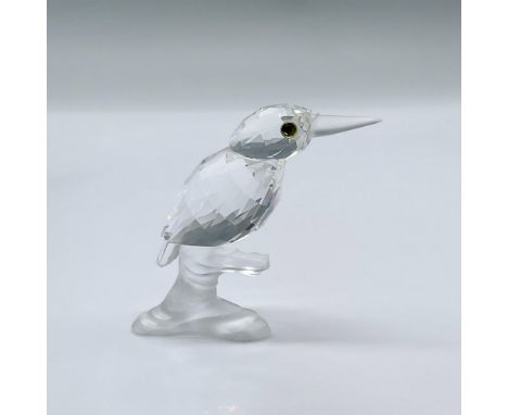 This charming birds is made from clear crystal, with a frosted beak, sitting on a frosted tree branch. This item has its orig