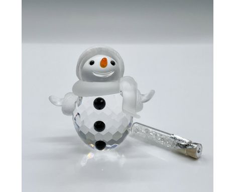 Features a charming snowman with a clear crystal body, a frosted face, scarf and hat, with black crystal buttons, and an oran