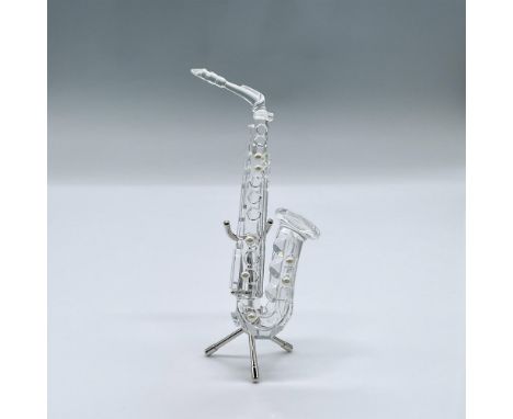 This lovely musical figure is made from clear crystal, with added pearls, and it comes with a rhodium stand. This item has it
