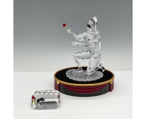 Final piece of the Masquerade trilogy, figure is crafted of clear, frosted, and black crystal holding a red crystal rose. Swa