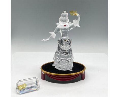 Second piece of the Masquerade trilogy. Figure stands with arm raised holding mask. Made of clear and satin crystal with yell