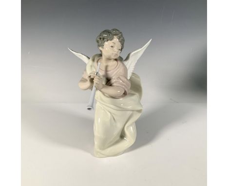 A sweet glossy figure of a heavenly boy in a long flowing outfit, holding up a clarinet. Lladro backstamp. This item has its 