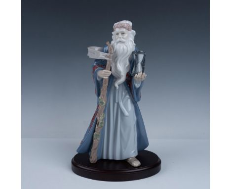 Glossy finish. Figure of an elderly man with a long beard, holding a staff and hourglass. Lladro backstamp. This item has its