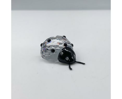 Fantastic crystal clear faceted figure that depicts a ladybug with contrasting black spots and a black head. This figure was 