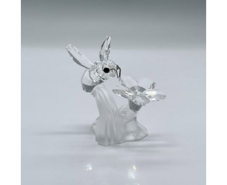 An adorable clear crystal bumble bee with black eyes and rhodium antennae, sitting on a frosted leaf. This item has its origi