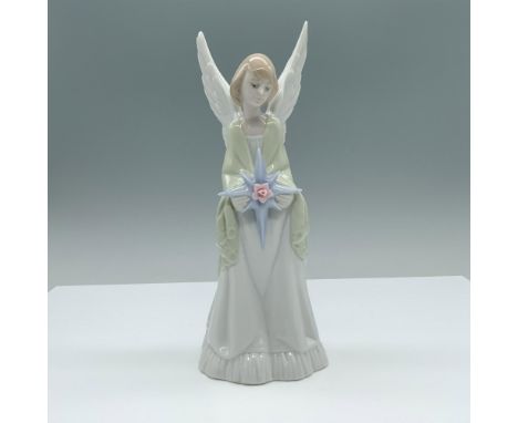 Glossy finish. Figure of an angel holding a shinning star. Lladro backstamp. This item has its original box. 6.75"L x 12"W x 