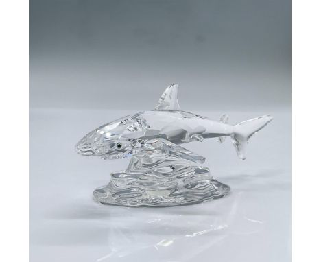 Features a clear faceted crystal shark with green eyes on a clear crystal base. This item has its original box measuring 6"L 