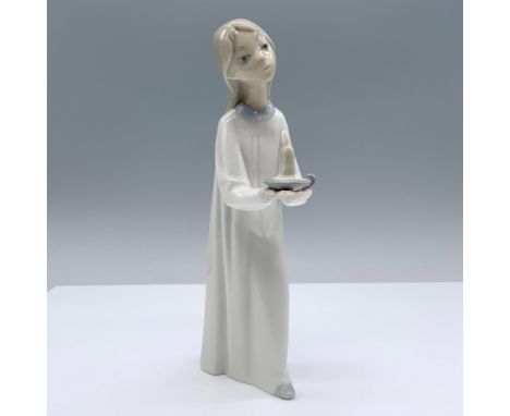 Glossy figure in night dress holding candle. Lladro backstamp. Artist: Fulgencio GarciaIssued: 1974-2000Dimensions: 2.25"L x 