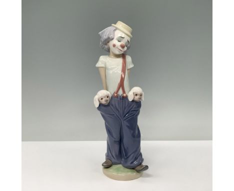 Glossy finish. A whimsical street clown in oversized blue pants and red suspenders, playfully housing two puppies peeking out