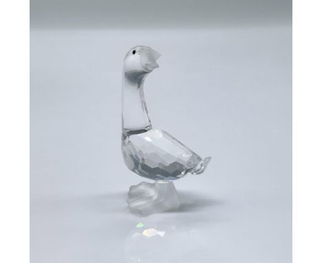 This figure is made from clear facetted crystal, it has black eyes with a frosted beak and frosted feet. This item has its or