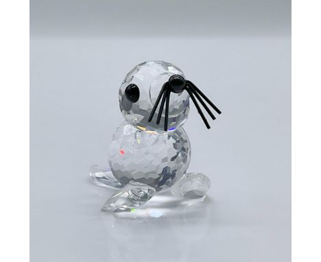 This cute crystal seal features black eyes, nose, and whiskers. This item has its original box. 3.25"L x 3.25"W x 2.5"H. Swar