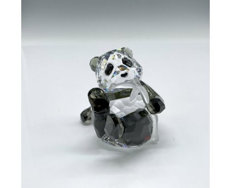 Beautiful clear and black crystal figure sitting with his bamboo stick. Swarovski backstamp. 905543. This item has its origin