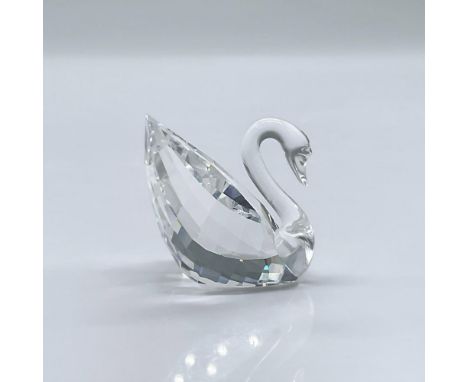 An adorable clear crystal swan. This item has its original box measuring 2.5"L x 2.5"W x 2.25"H. Swarovski acid mark. Artist:
