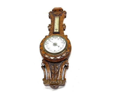 Carved wall hanging barometer measures approx 25" long 