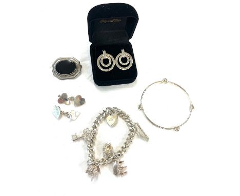 Silver jewellery to include a charm bracelet, earrings, cufflinks etc 